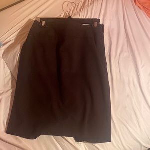 Black skirt goes well with office wear